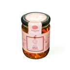 A glass jar of Mahalaxmi Garlic Pickle with a pink and white label and a black lid, set against a plain white background.