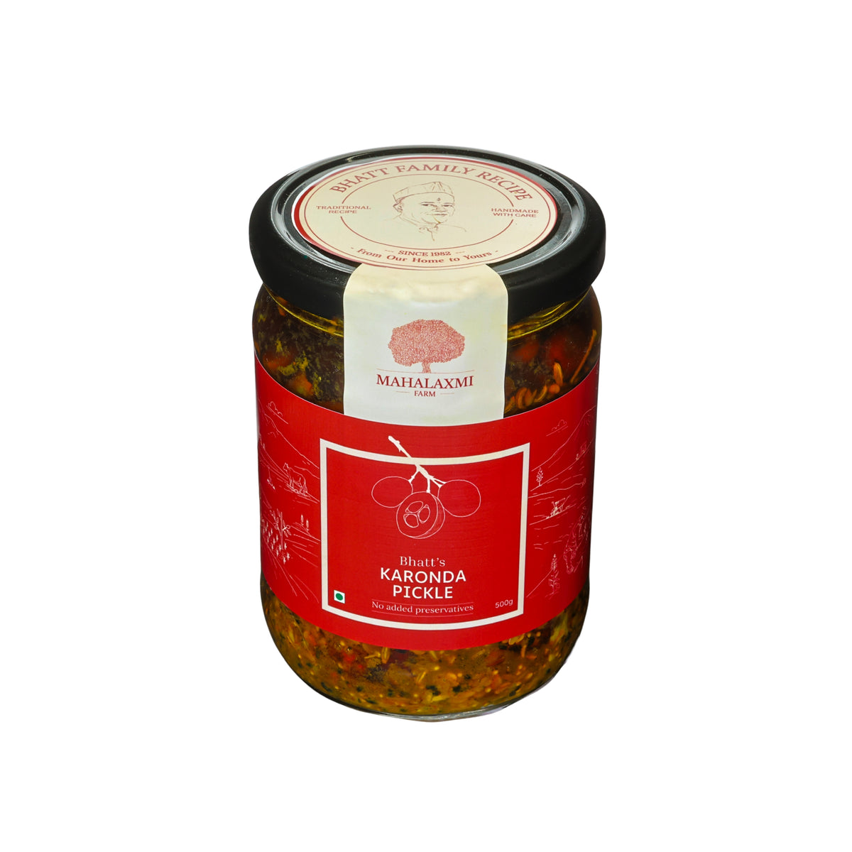 A glass jar of Karonda Pickle with a red label and black lid, set against a plain white background.